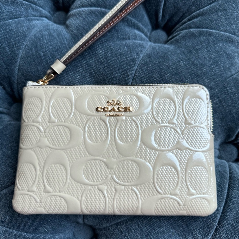 Coach corner zip in signature leather with wrist strap